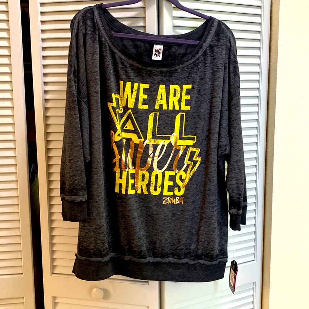 New with tags “Everyone is a Hero” Zumba top in XLovely